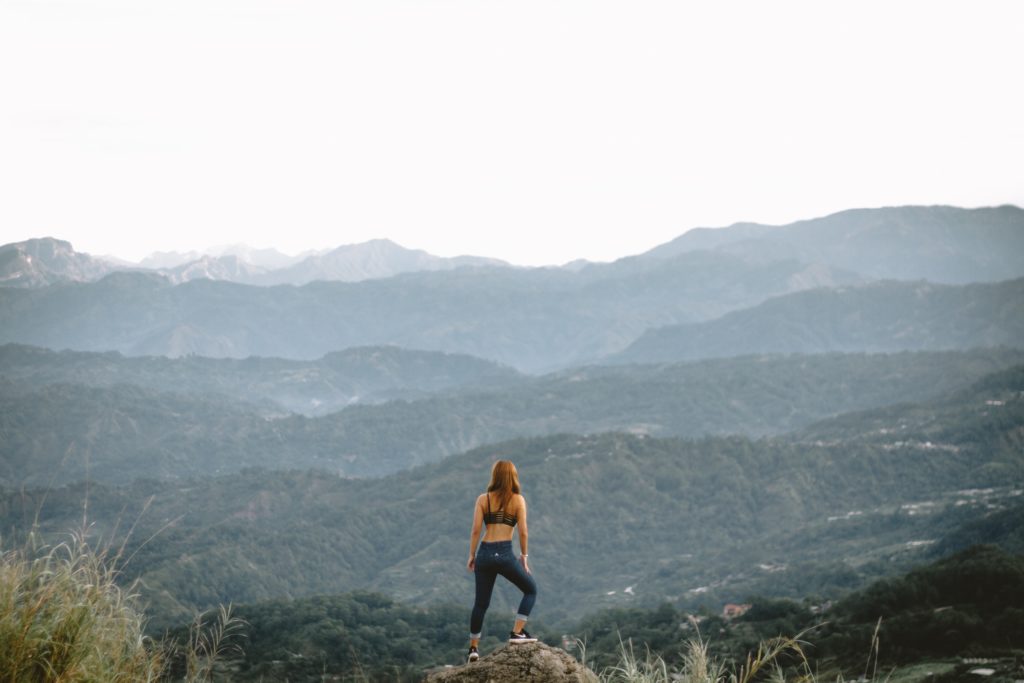 Woman on a mountaintop.